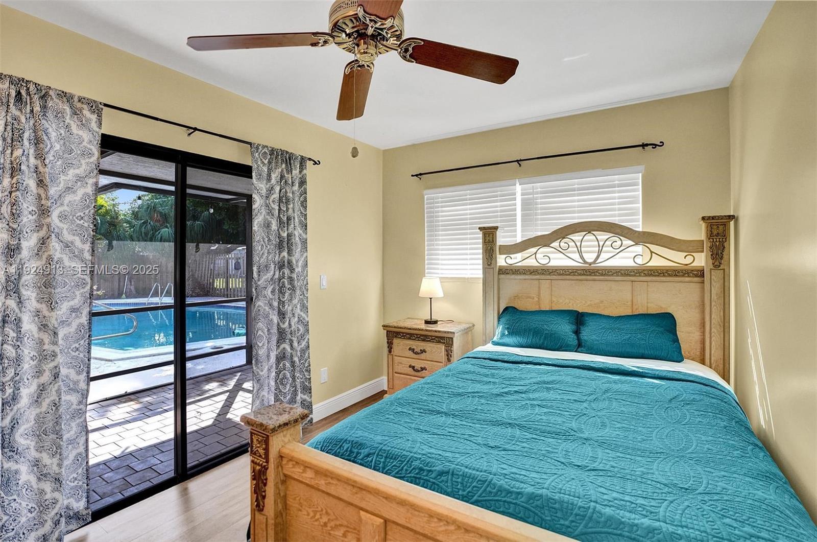 2620 Northeast 19th Street Pompano Beach, FL 33062 - Photo 27 of 42 a bedroom with a bed and window