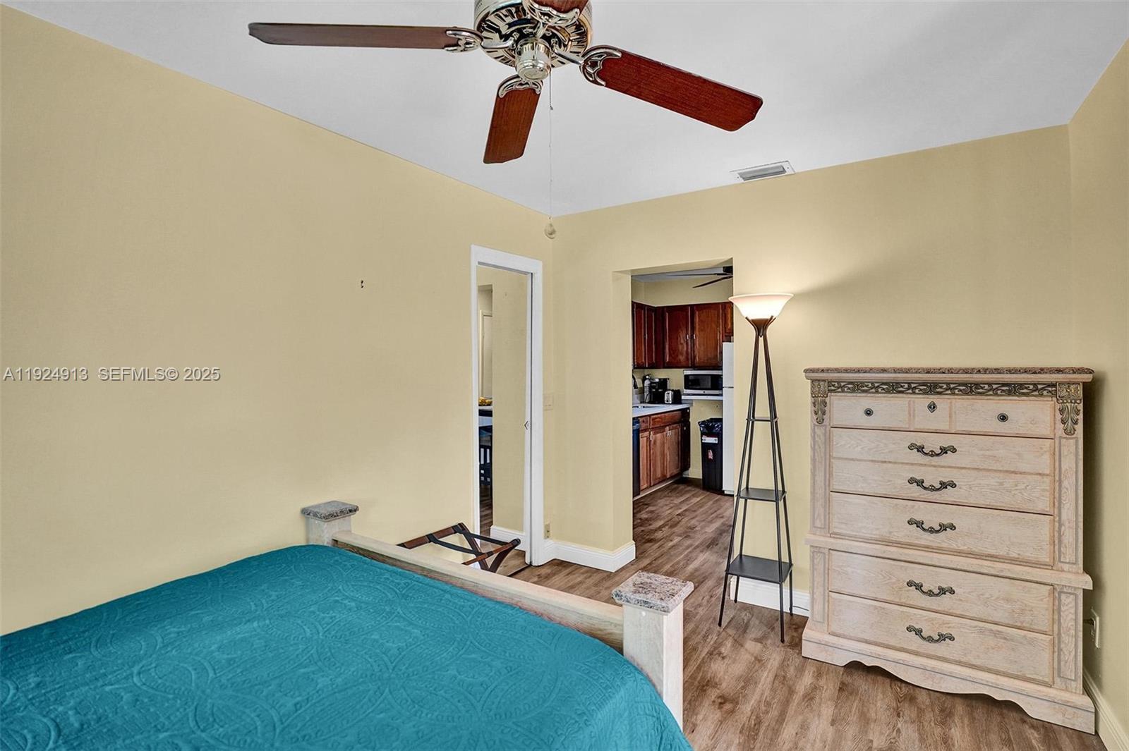 2620 Northeast 19th Street Pompano Beach, FL 33062 - Photo 28 of 42 a bedroom with a bed and furniture