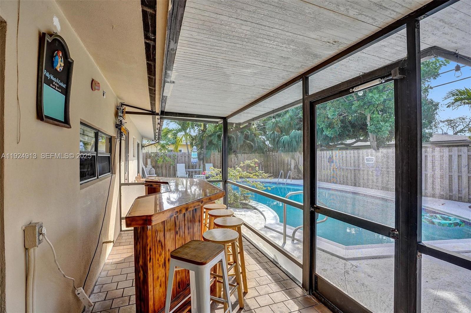 2620 Northeast 19th Street Pompano Beach, FL 33062 - Photo 31 of 42 a view of an chairs and table in the balcony