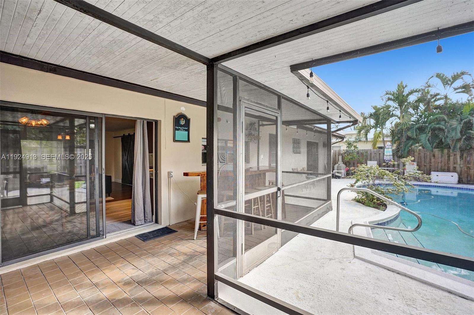 2620 Northeast 19th Street Pompano Beach, FL 33062 - Photo 32 of 42 a house with trees in front of it