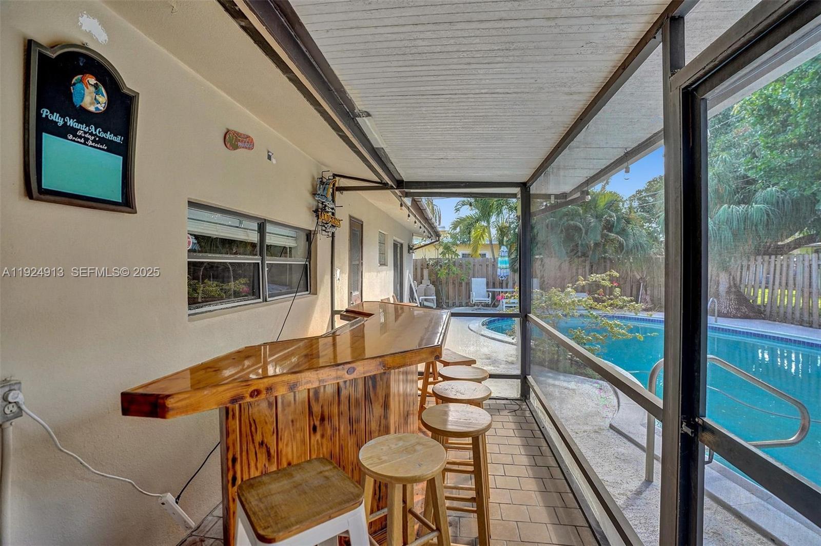 2620 Northeast 19th Street Pompano Beach, FL 33062 - Photo 33 of 42 a balcony with table and chairs