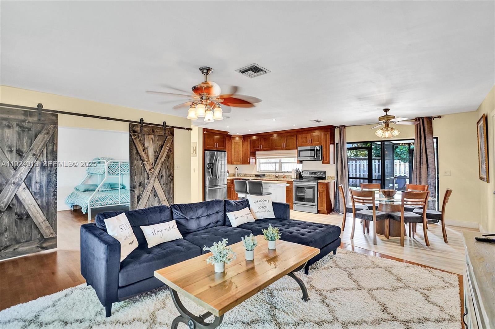 2620 Northeast 19th Street Pompano Beach, FL 33062 - Photo 6 of 42 a living room with furniture and a large window