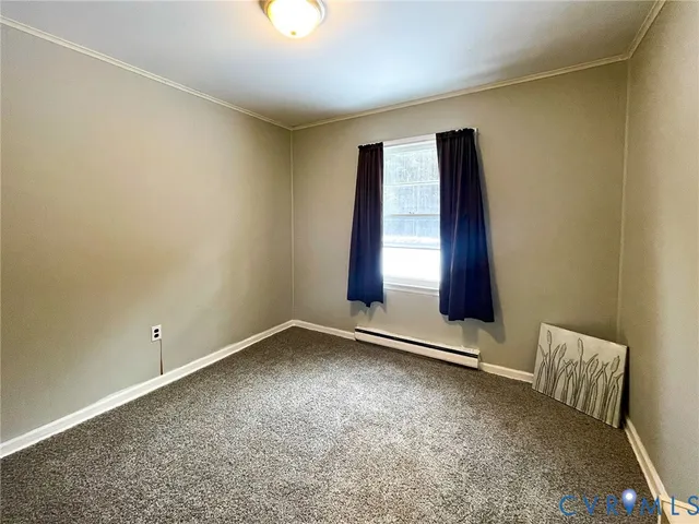 an empty room with closet and cabinet