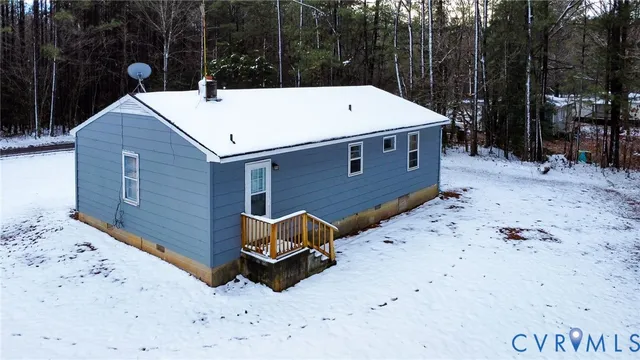a view of a backyard with a barbeque and wooden stairs
