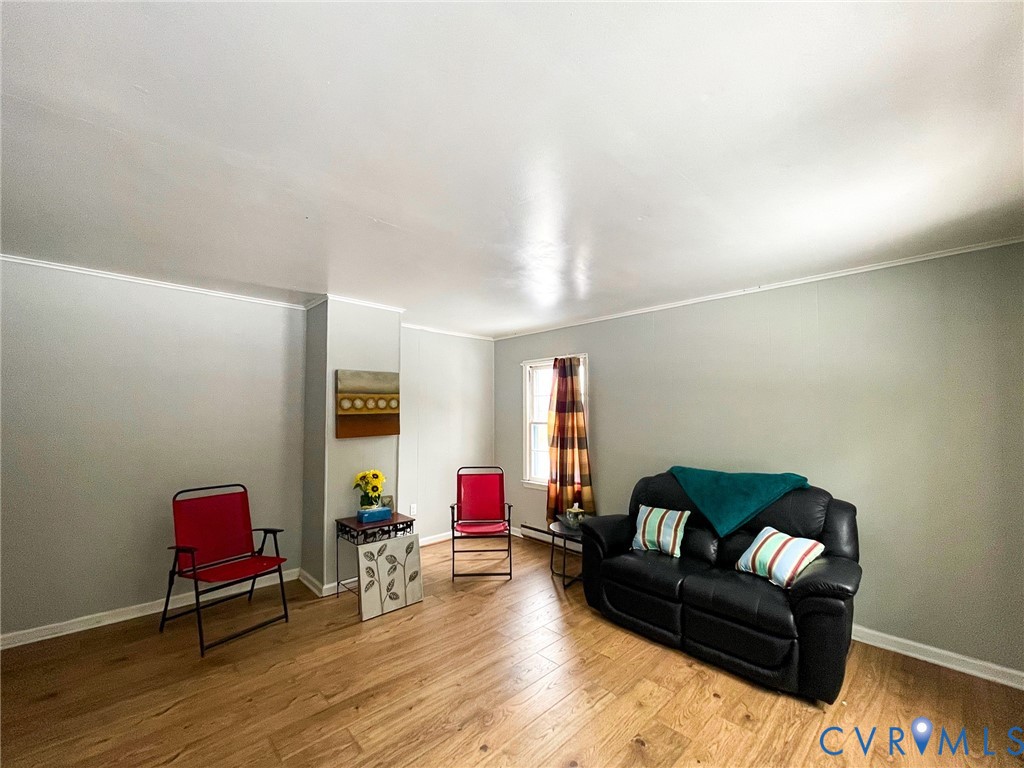 3867 Longview Road Kenbridge, VA 23944 - Photo 4 of 25 a living room with furniture and a wooden floor