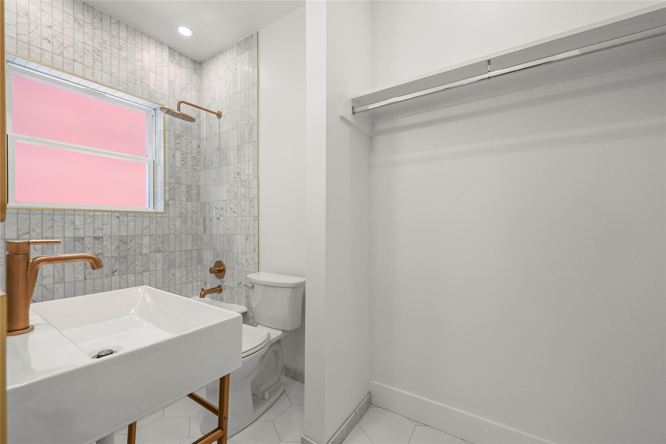 808 Sul Ross Street, Unit 2 Houston, TX 77006 - Photo 9 of 11 a bathroom with a sink a shower and a mirror