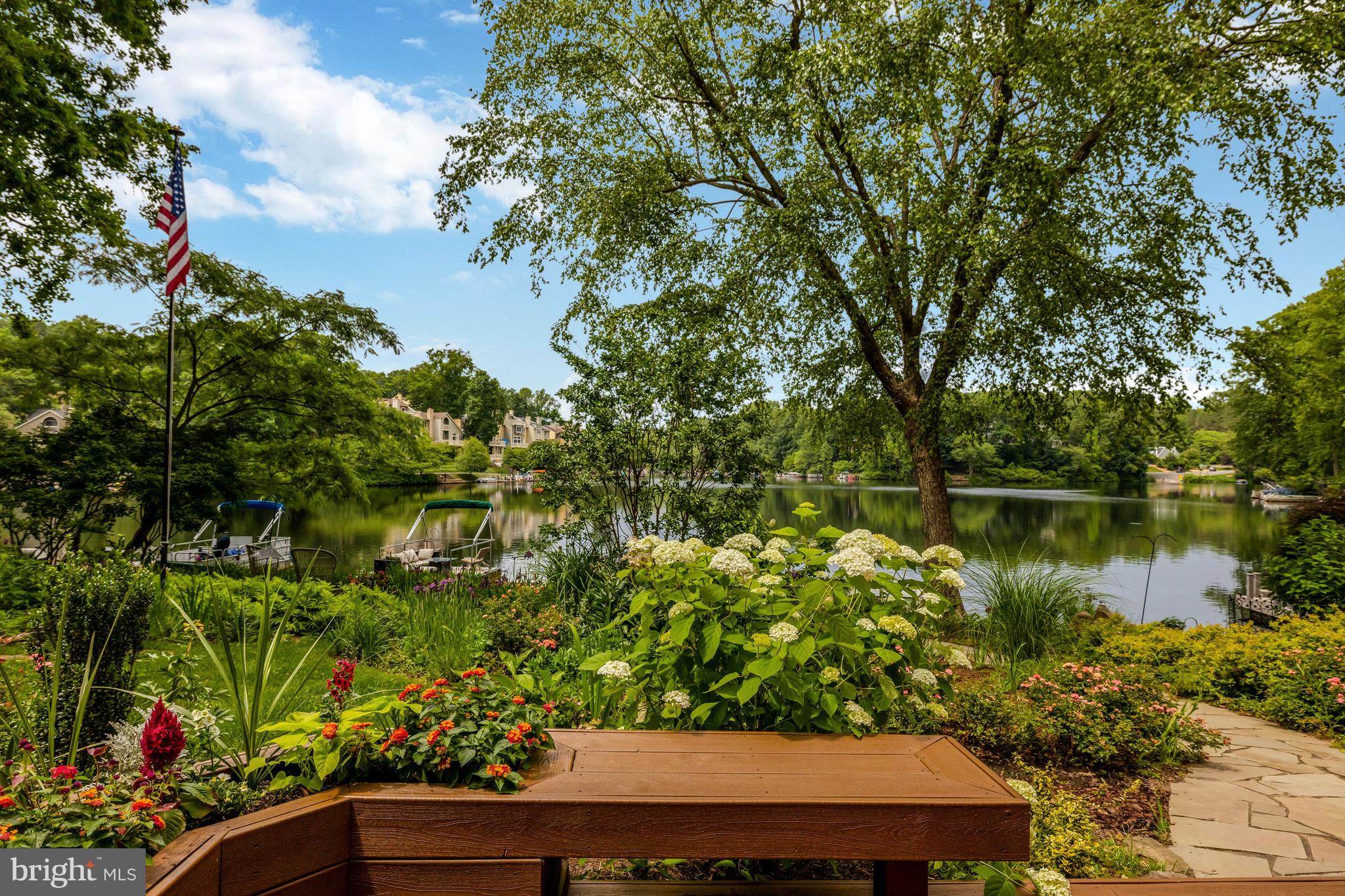 11064 Thrush Ridge Road Reston, VA 20191 - Photo 59 of 85 Enjoy the built-in benches and lake views.