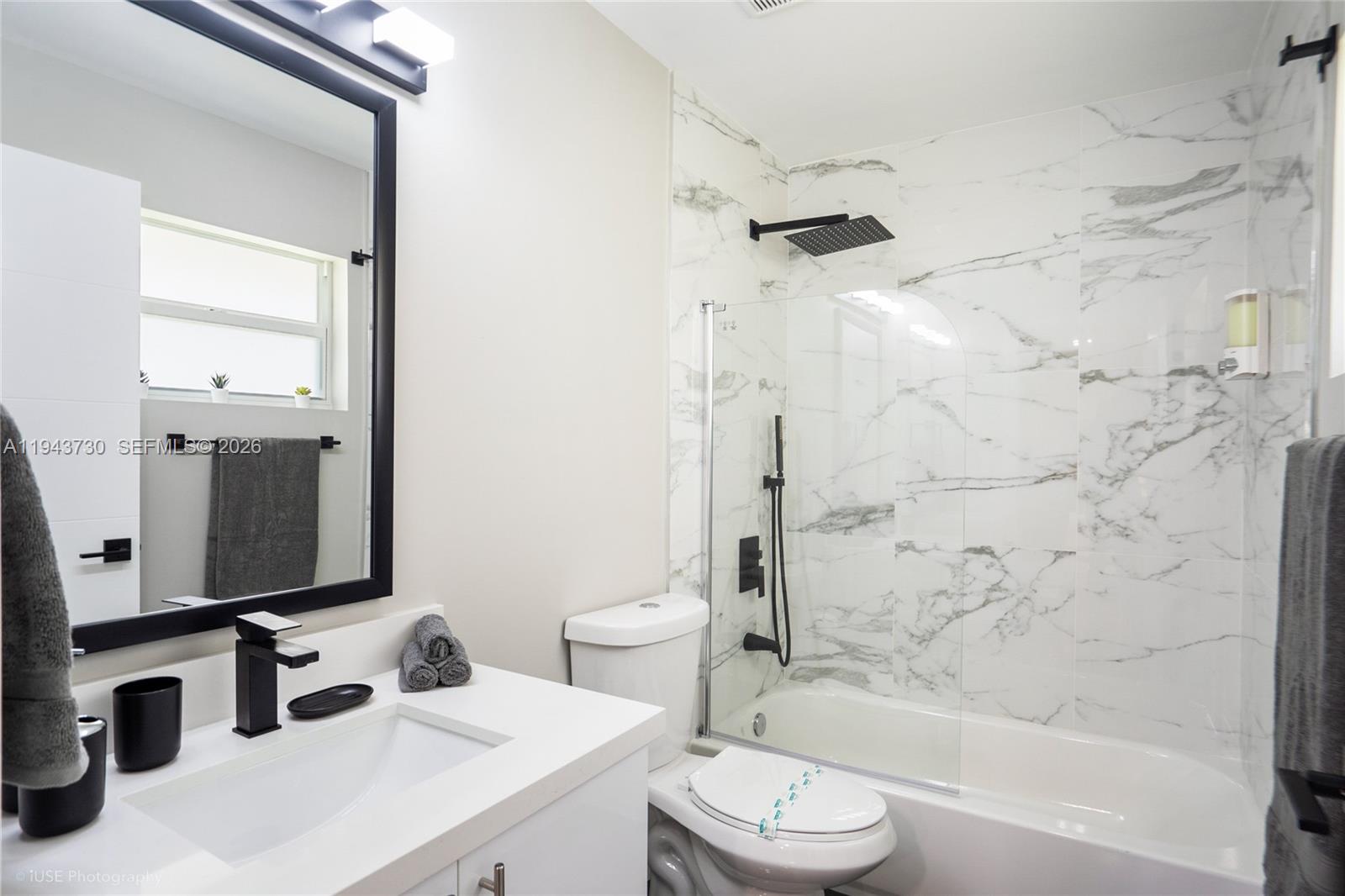 1035 Northwest 48th Street Miami, FL 33127 - Photo 16 of 29 a bathroom with a sink toilet tub and shower