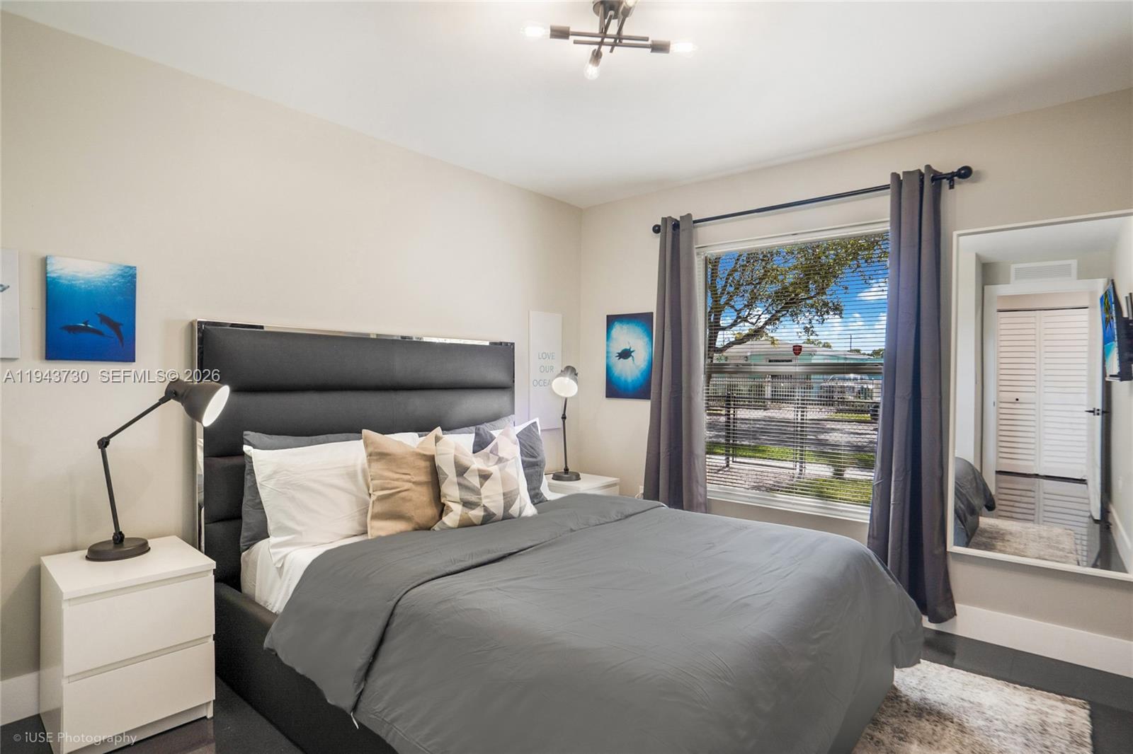 1035 Northwest 48th Street Miami, FL 33127 - Photo 17 of 29 a bedroom with a bed and a window