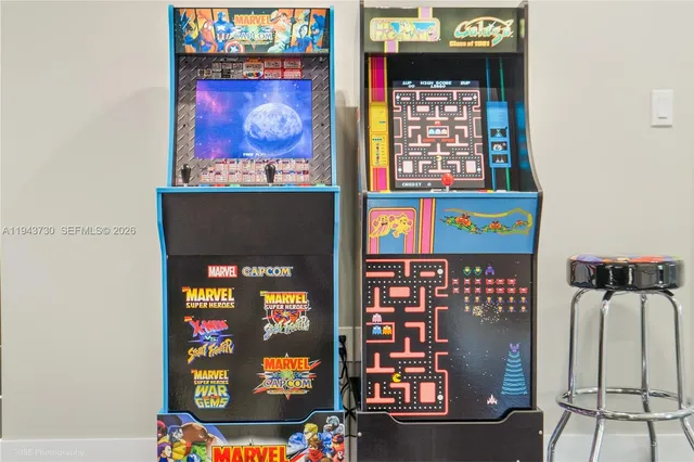 a room with a potted plant on a table and a mirror