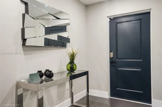 a living room with furniture and a book shelf