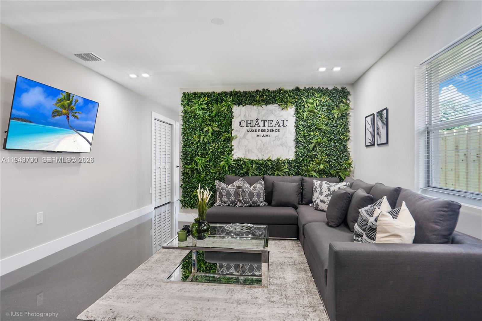 1035 Northwest 48th Street Miami, FL 33127 - Photo 21 of 29 a living room with furniture and a painting