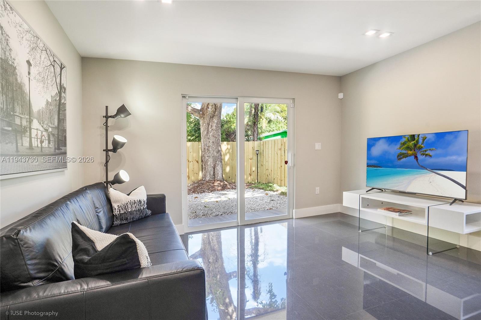 1035 Northwest 48th Street Miami, FL 33127 - Photo 24 of 29 a living room with furniture and a large window