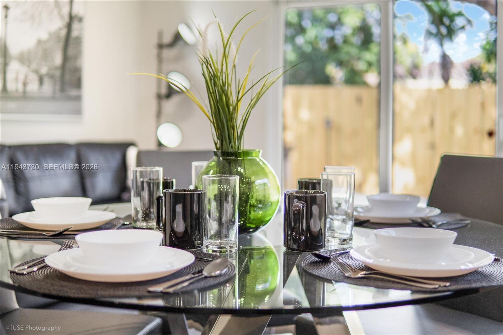 1035 Northwest 48th Street Miami, FL 33127 - Photo 27 of 29 a dining room with furniture and wooden floor