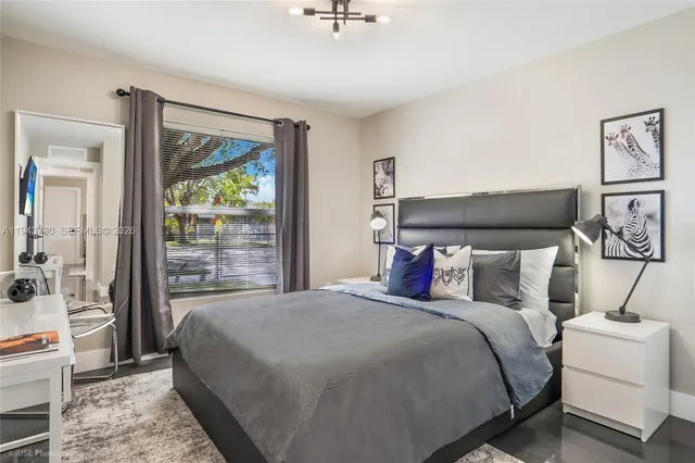 a bed room with a bed and a window