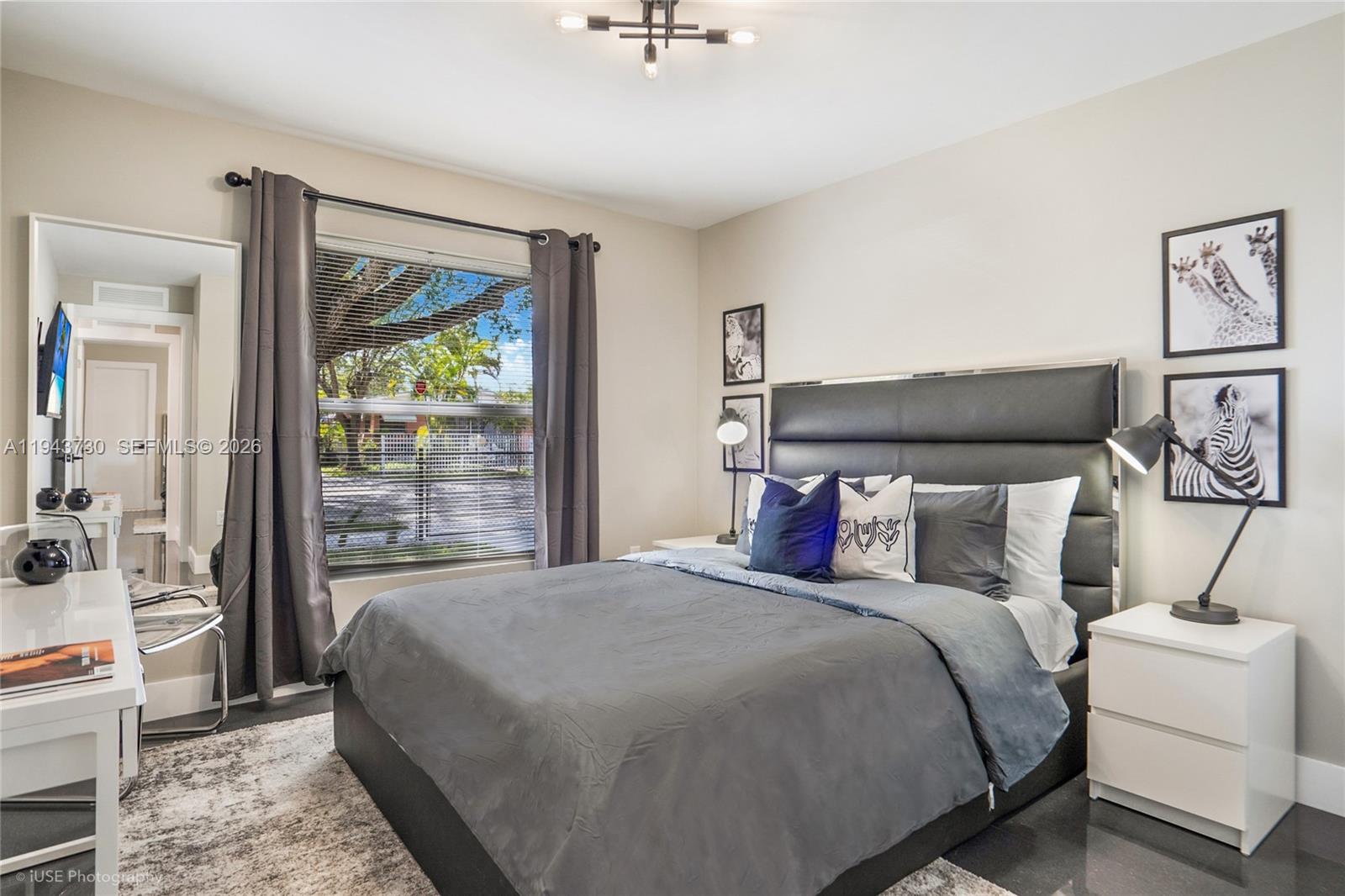 1035 Northwest 48th Street Miami, FL 33127 - Photo 10 of 29 a bed room with a bed and a window