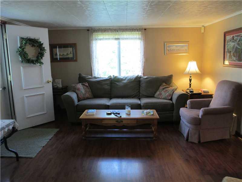 484 Flatwoods Road Vanderbilt, PA 15486 - Photo 5 of 20 Living Room. Bright living room off the front porch opens to the kitchen and hall to the bedrooms and bath.