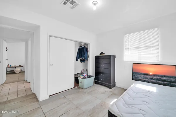 a bedroom with furniture and a window