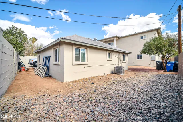 an aerial view of a house with a swimming pool