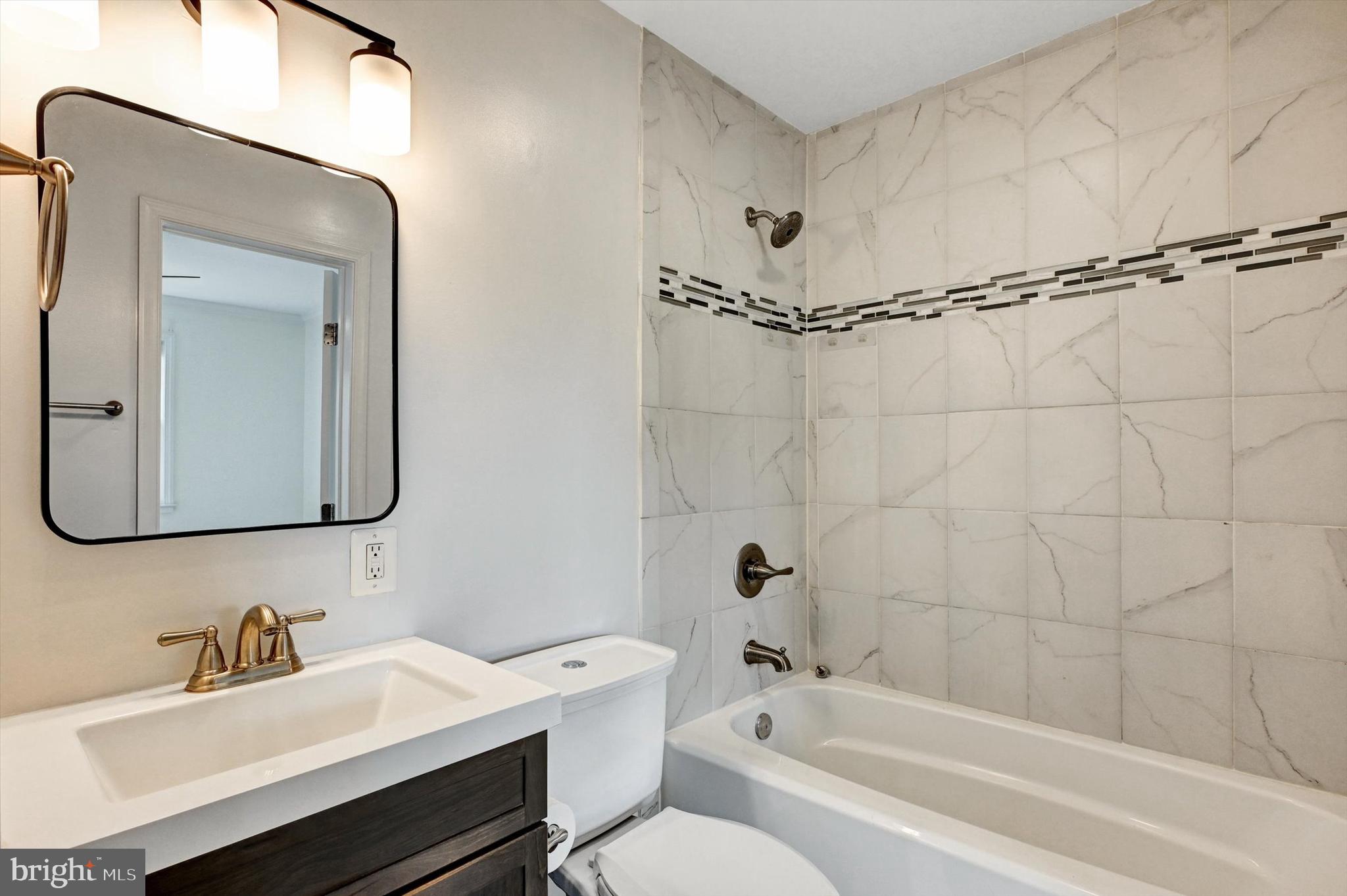 3521 Dunhaven Road Baltimore, MD 21222 - Photo 19 of 35 a bathroom with a sink and a mirror