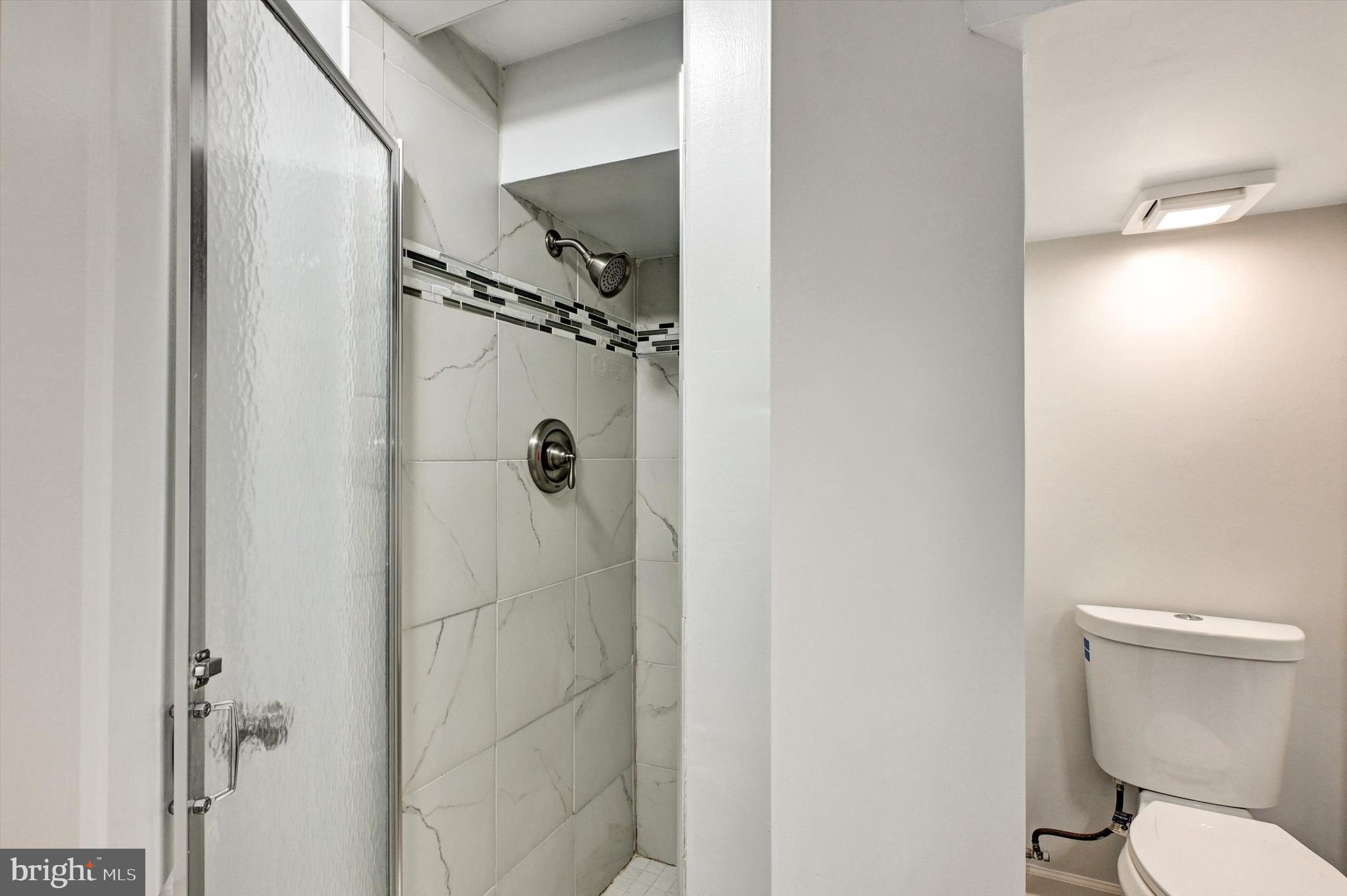 3521 Dunhaven Road Baltimore, MD 21222 - Photo 24 of 35 a bathroom with a toilet and a shower