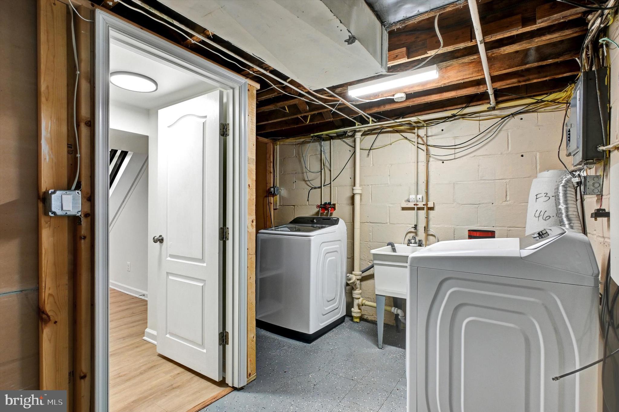 3521 Dunhaven Road Baltimore, MD 21222 - Photo 26 of 35 a view of storage and utility room with washer and dryer