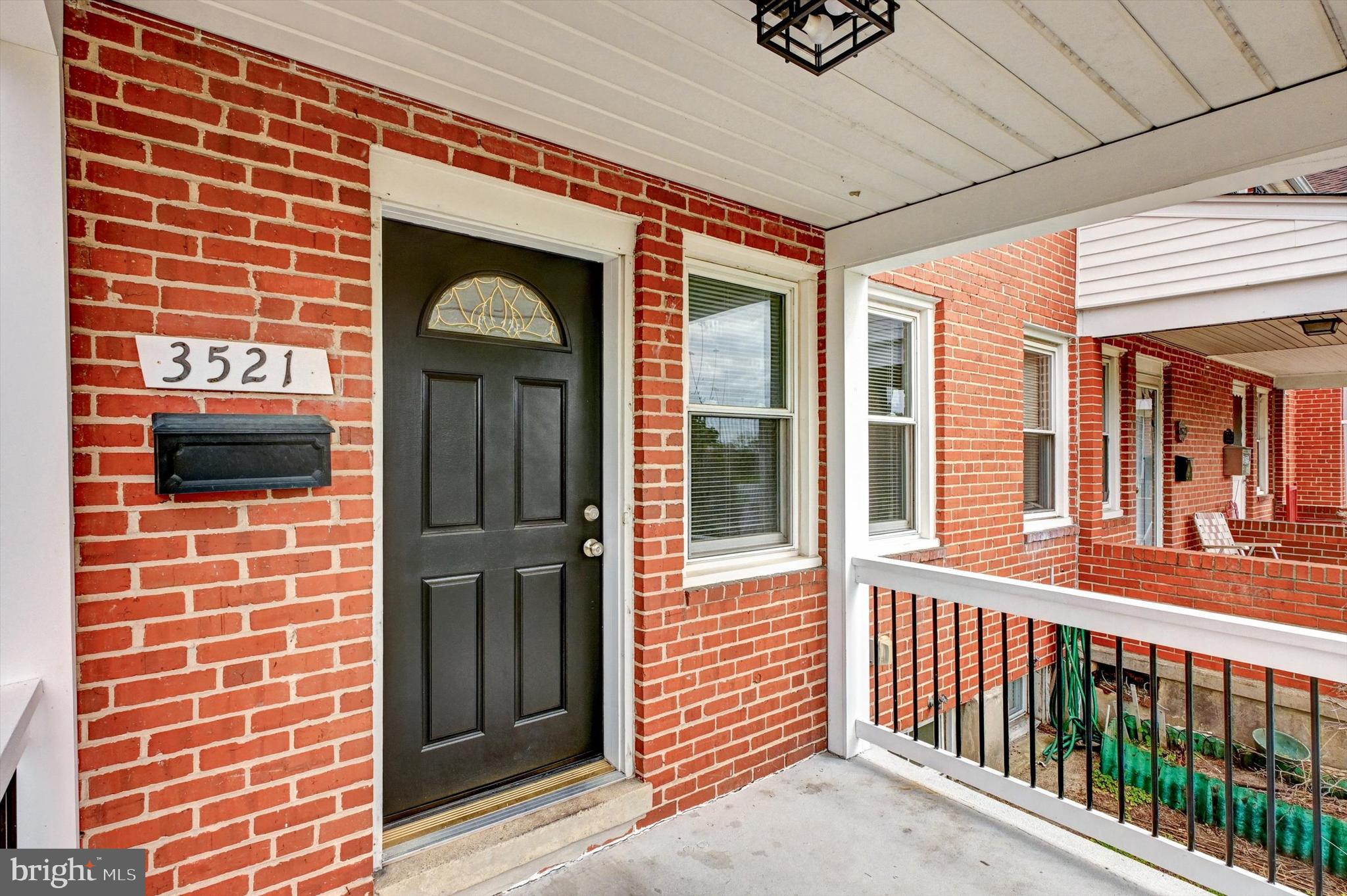 3521 Dunhaven Road Baltimore, MD 21222 - Photo 27 of 35 a view of a brick buildings from a windows