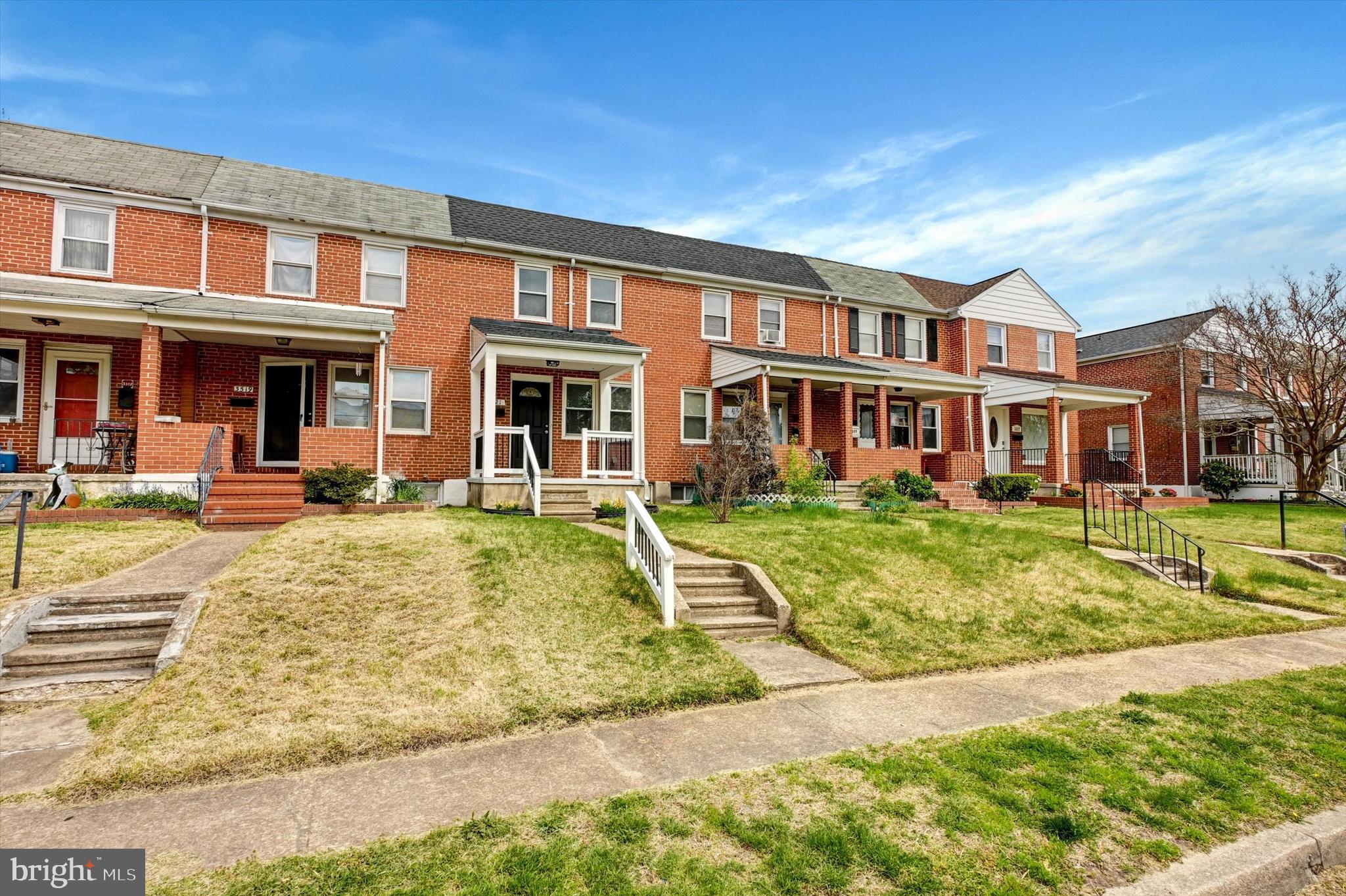 3521 Dunhaven Road Baltimore, MD 21222 - Photo 29 of 35 a front view of a residential apartment building with a yard