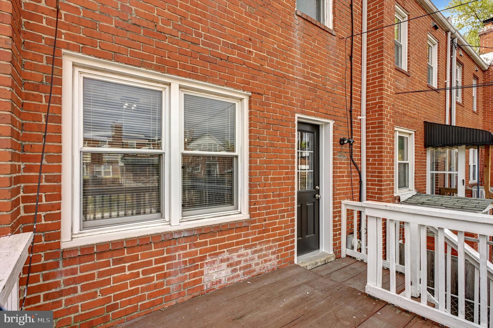 3521 Dunhaven Road Baltimore, MD 21222 - Photo 30 of 35 a view of a brick house with large windows