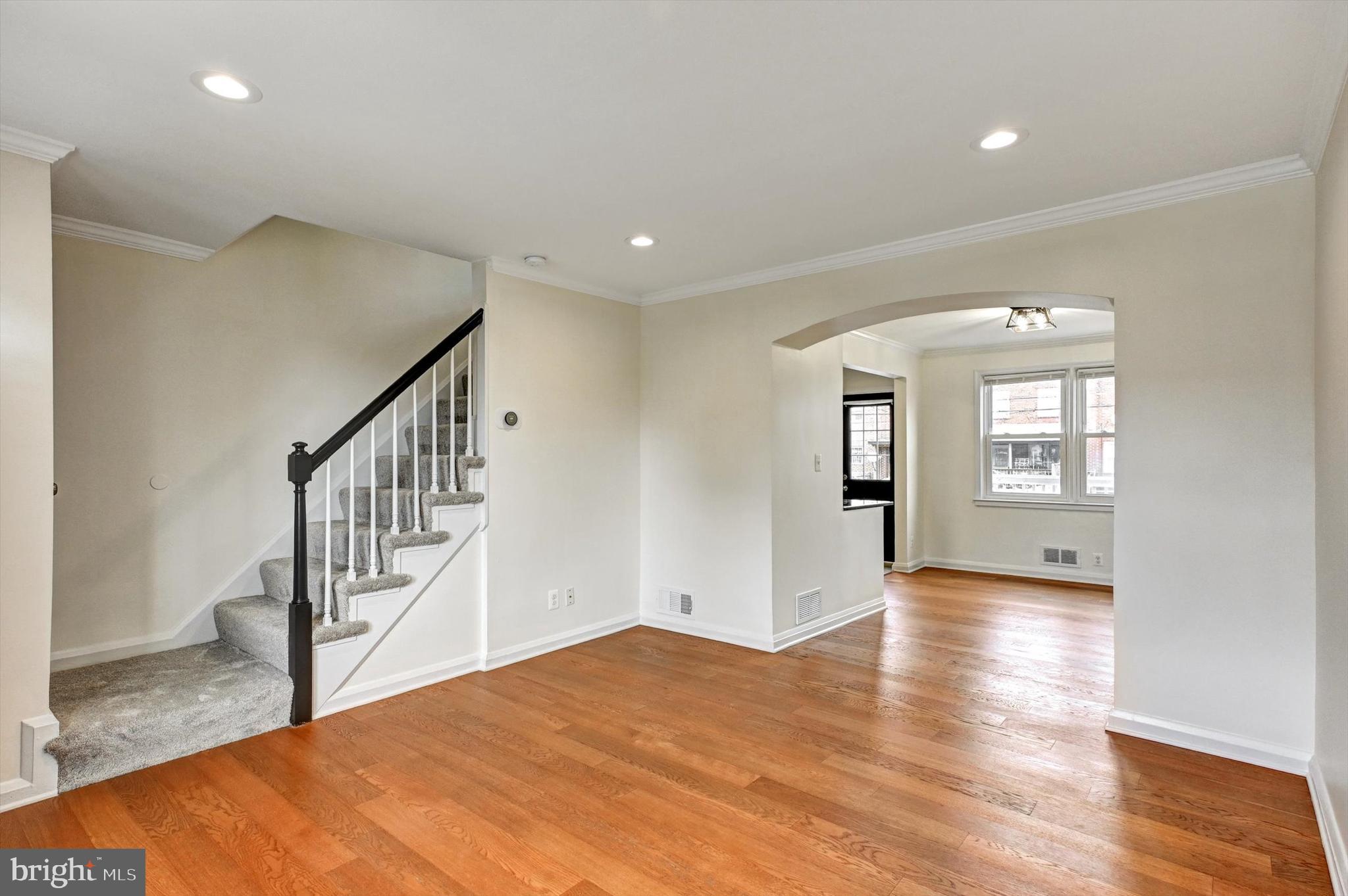 3521 Dunhaven Road Baltimore, MD 21222 - Photo 3 of 35 a view of empty room with wooden floor and fan