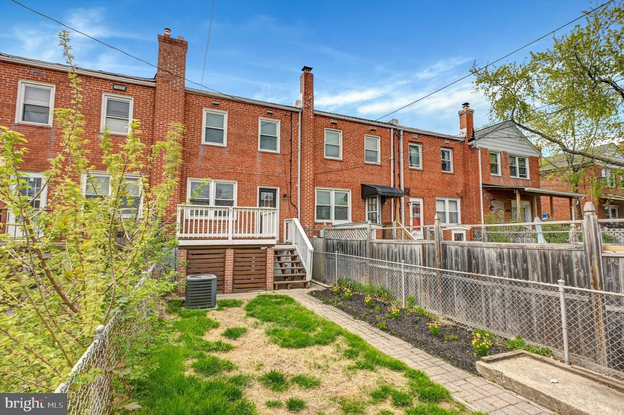 3521 Dunhaven Road Baltimore, MD 21222 - Photo 34 of 35 a front view of a house with a yard