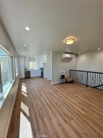 a view of a living room and wooden floor