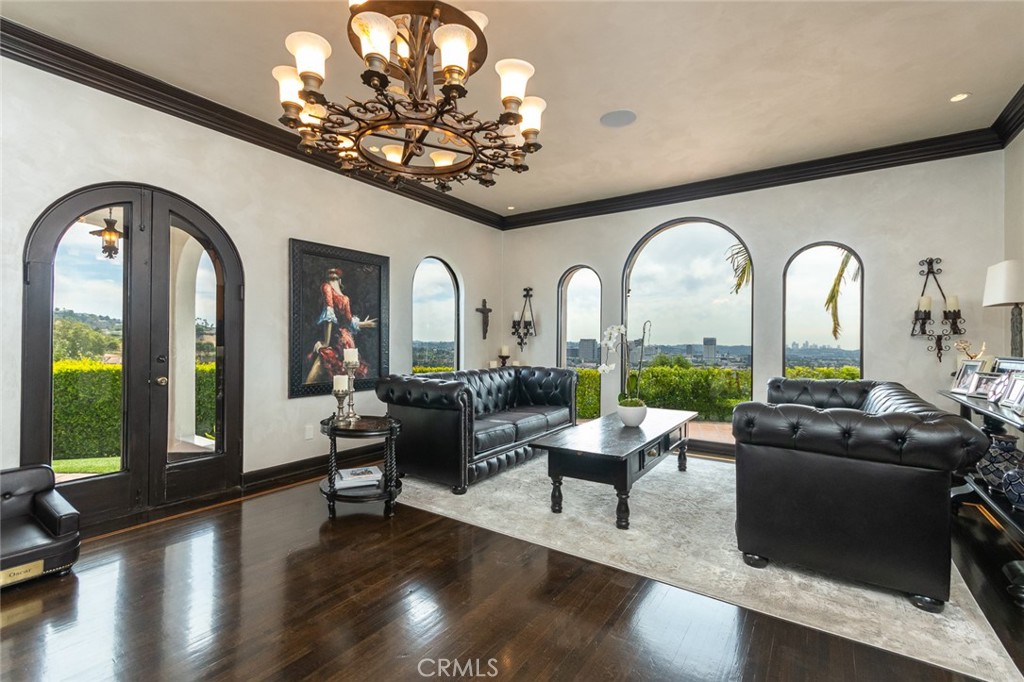 330 Kempton Road Glendale, CA 91202 - Photo 12 of 75 a living room with patio furniture and a chandelier