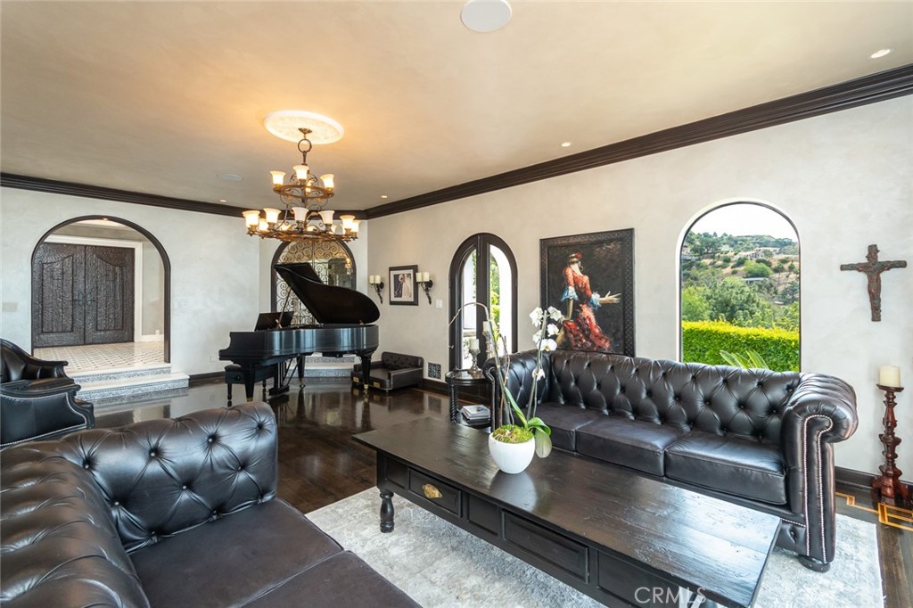 330 Kempton Road Glendale, CA 91202 - Photo 14 of 75 a living room with furniture chandelier and a large window