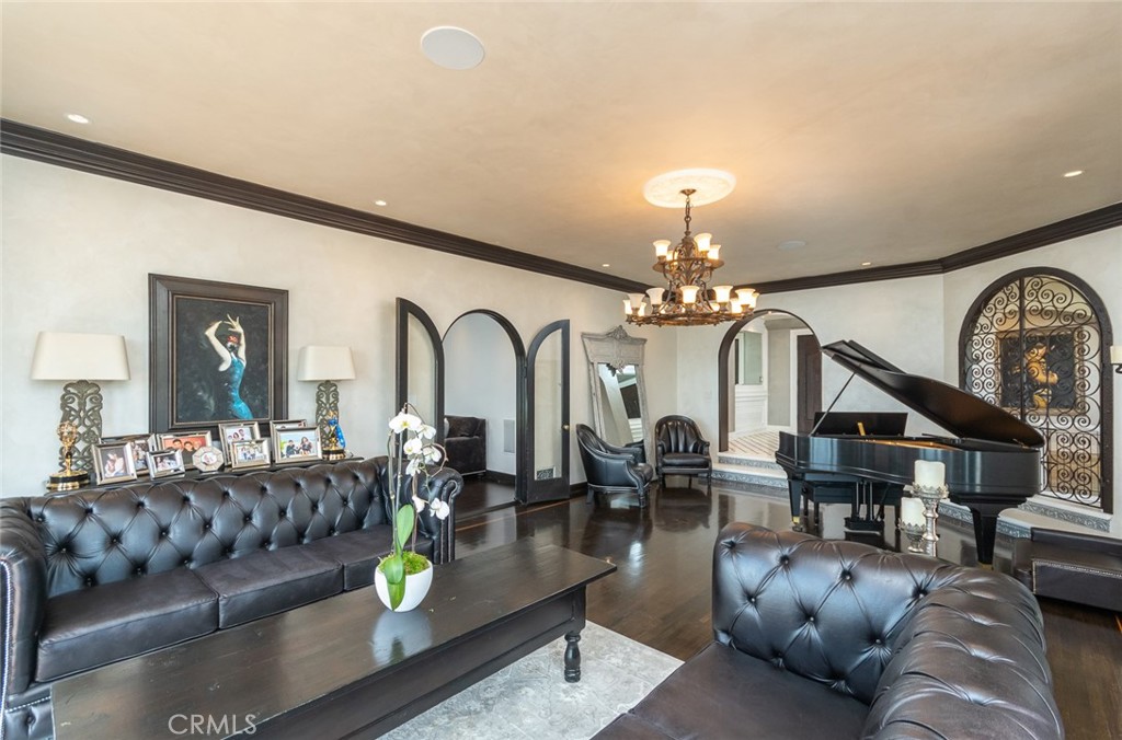 330 Kempton Road Glendale, CA 91202 - Photo 15 of 75 a living room with furniture a chandelier and a fireplace
