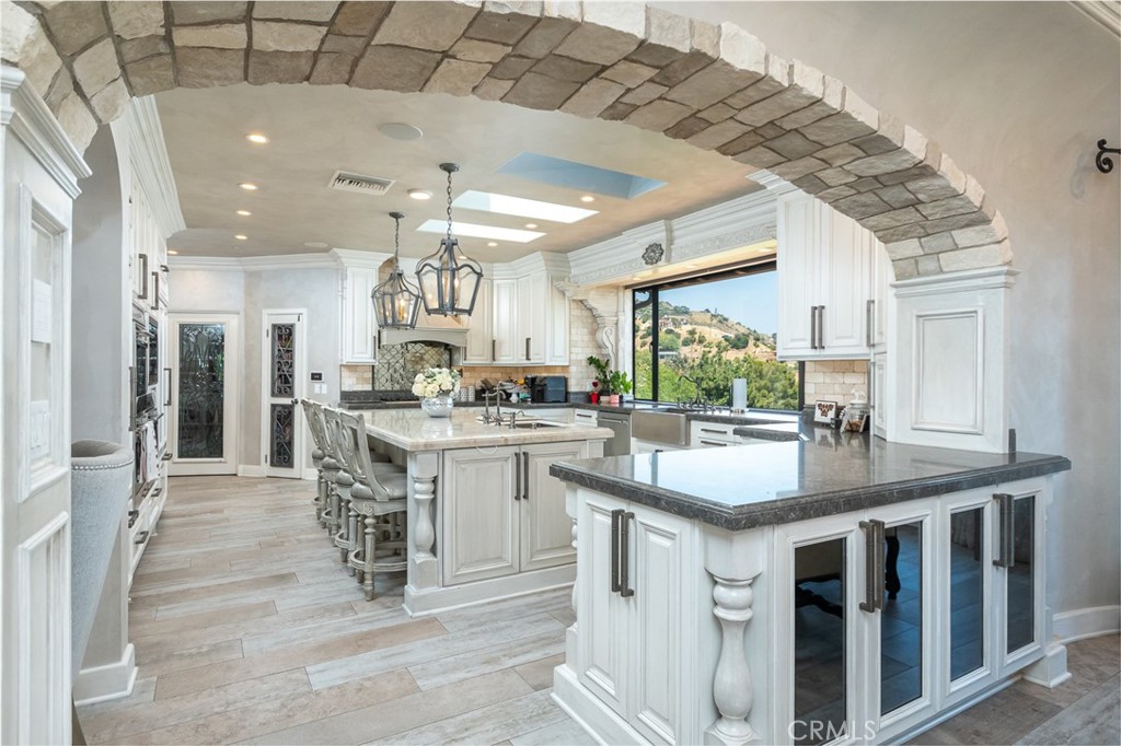330 Kempton Road Glendale, CA 91202 - Photo 24 of 75 a kitchen with stainless steel appliances granite countertop a sink stove and cabinets