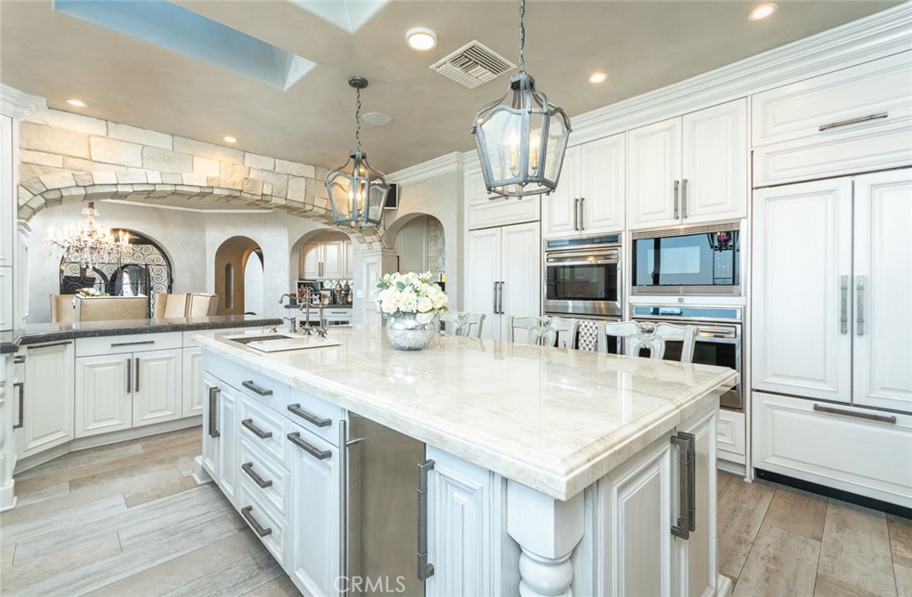 330 Kempton Road Glendale, CA 91202 - Photo 30 of 75 a kitchen with stainless steel appliances granite countertop a sink and refrigerator