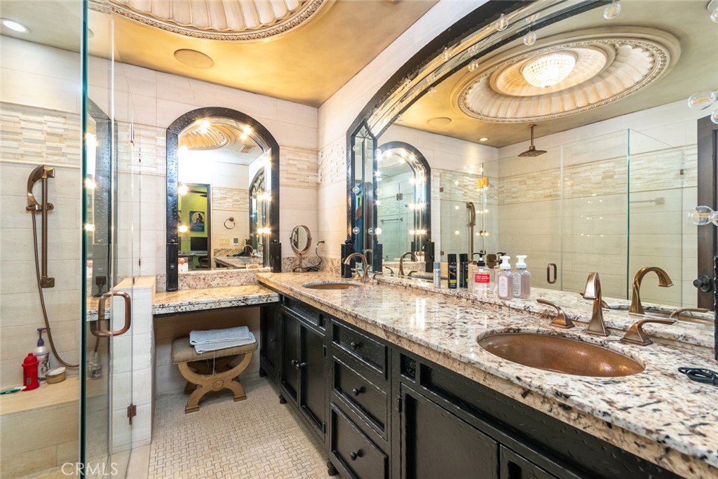330 Kempton Road Glendale, CA 91202 - Photo 51 of 75 a bathroom with a granite countertop double vanity sink and a mirror