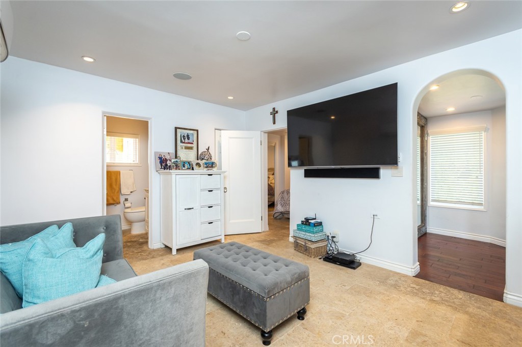 330 Kempton Road Glendale, CA 91202 - Photo 58 of 75 a living room with furniture and a flat screen tv