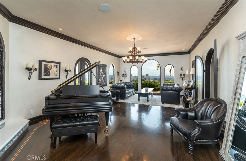 330 Kempton Road Glendale, CA 91202 - Photo 10 of 75 a living room with couches a piano and wooden floor