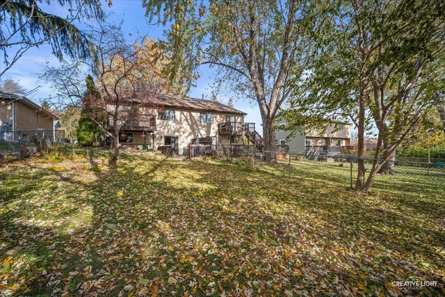 a view of a yard with a tree
