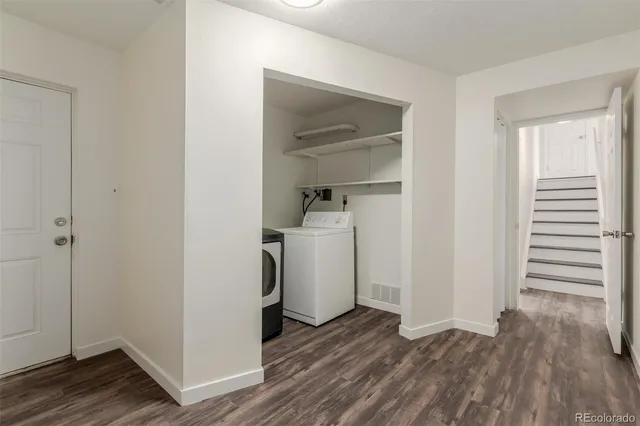 a view of a room with wooden floor and closet
