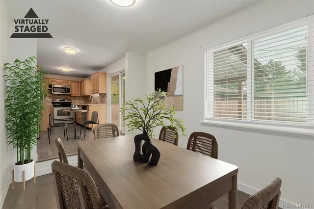 a view of a workspace with furniture and a potted plant