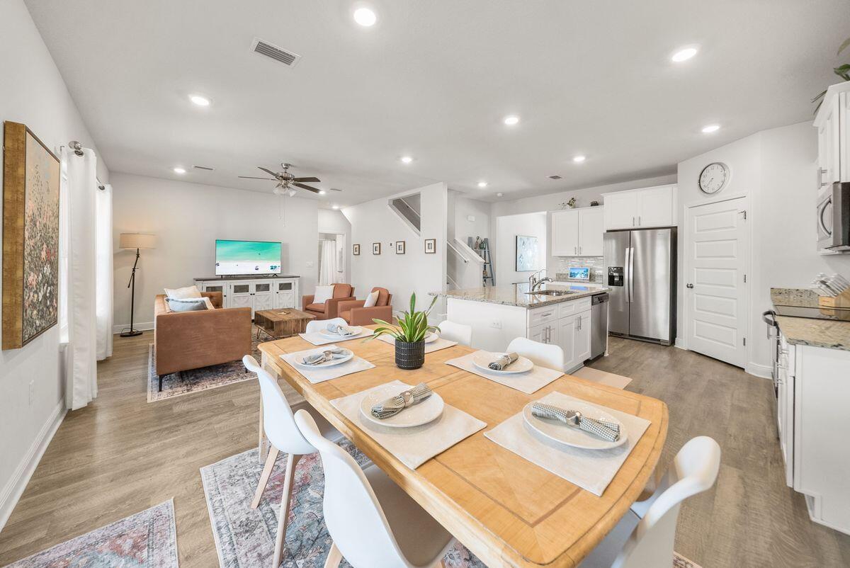 774 Backwater Road Port St. Joe, FL 32456 - Photo 15 of 65 a living room with lots of furniture and kitchen view