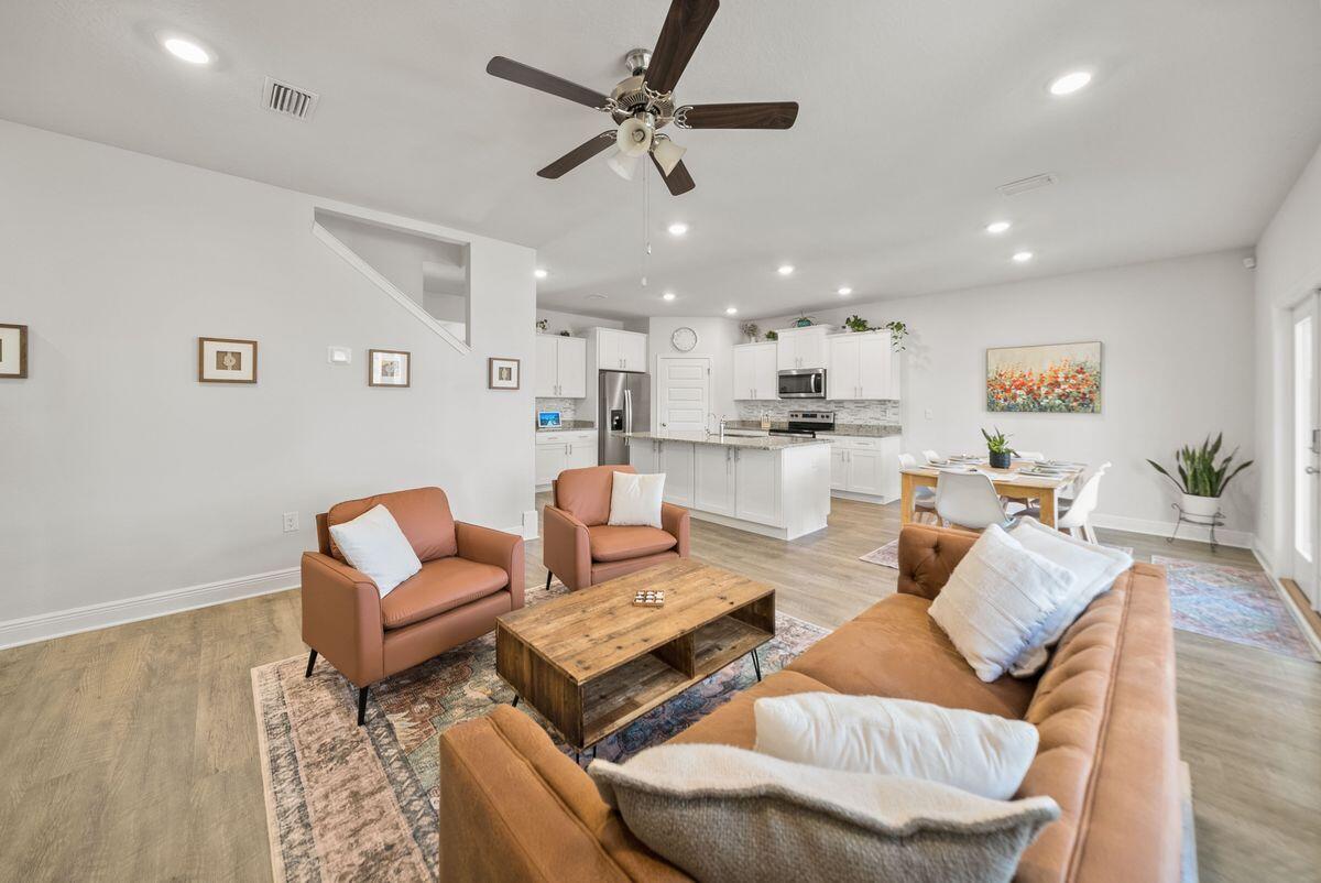 774 Backwater Road Port St. Joe, FL 32456 - Photo 17 of 65 a living room with furniture and kitchen view