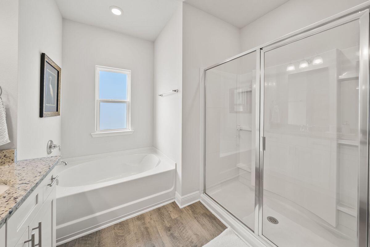 774 Backwater Road Port St. Joe, FL 32456 - Photo 24 of 65 a bathroom with a granite countertop bathtub shower and sink