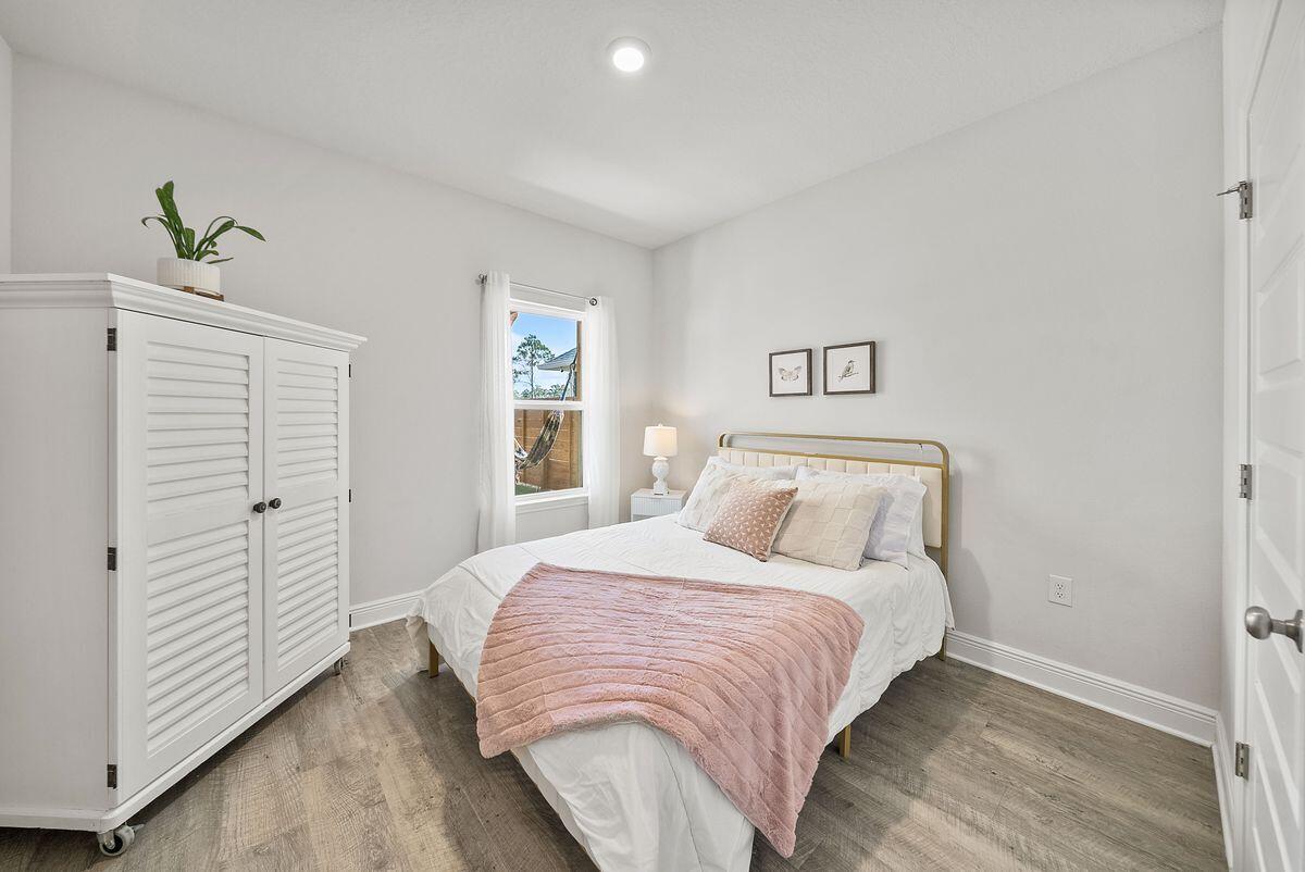 774 Backwater Road Port St. Joe, FL 32456 - Photo 25 of 65 a bedroom with a bed and a window