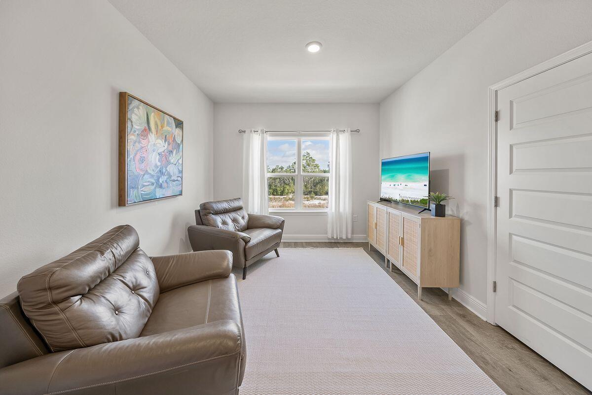 774 Backwater Road Port St. Joe, FL 32456 - Photo 31 of 65 a living room with furniture and a window