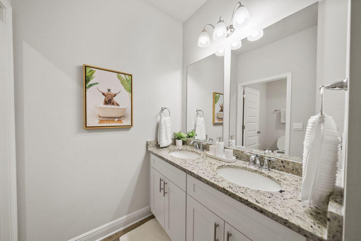 774 Backwater Road Port St. Joe, FL 32456 - Photo 34 of 65 a bathroom with a double vanity sink and a mirror