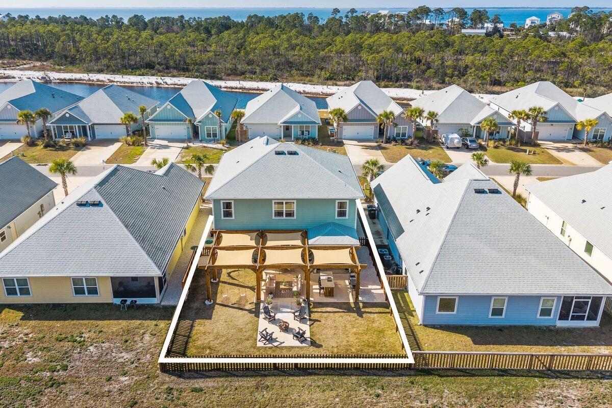 774 Backwater Road Port St. Joe, FL 32456 - Photo 52 of 65 an aerial view of a house with a yard